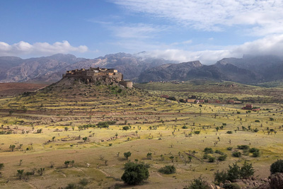 An ancient fortified granary called Kasbah Tizourgane with the Anti Atlas Mountains in the background