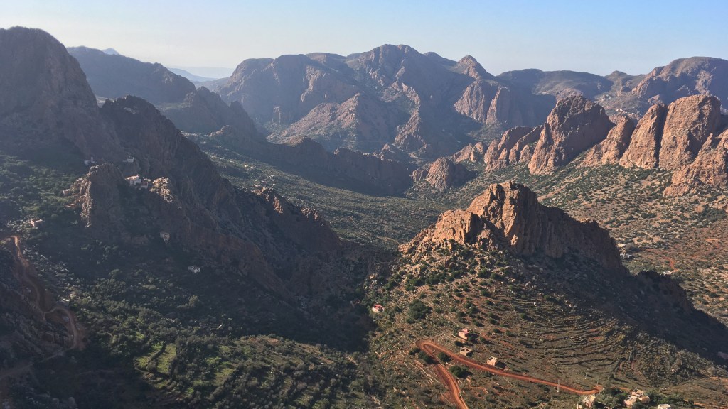 Landscape of a valley filled with steep rock faces in the Anti Atlas Mountains
